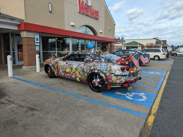 Fascinating and different photo of a car covered in stickers in front of a Wawa store, a unique USA sight.
