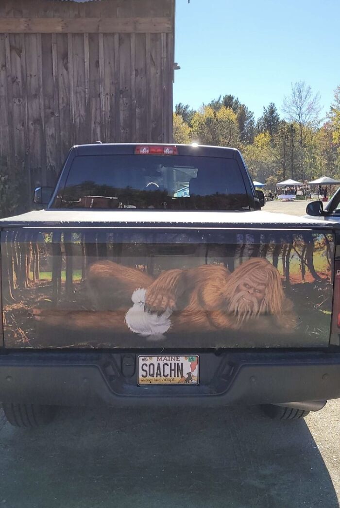 Truck with a Bigfoot painting on the tailgate and a custom license plate, unique photos of the USA.