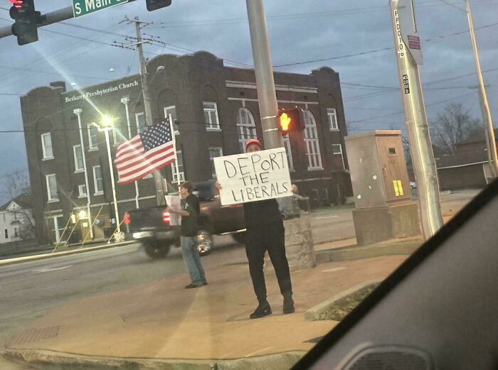 Two men with an American flag and a sign that says DEPORT THE LIBERALS, capturing different photos of the USA.