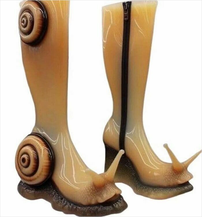 Unusual snail-shaped boots with glossy finish, captured in a camera roll photo that needs no explanation.
