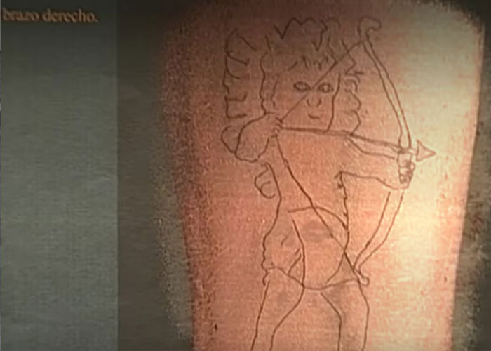 Detail of a tattoo, an identifying mark of the 20YO man whose horrific fate was discovered by a stray dog.