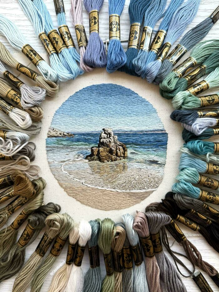 A realistic ocean beach scene created with blue and sandy threads as part of unique embroidery projects