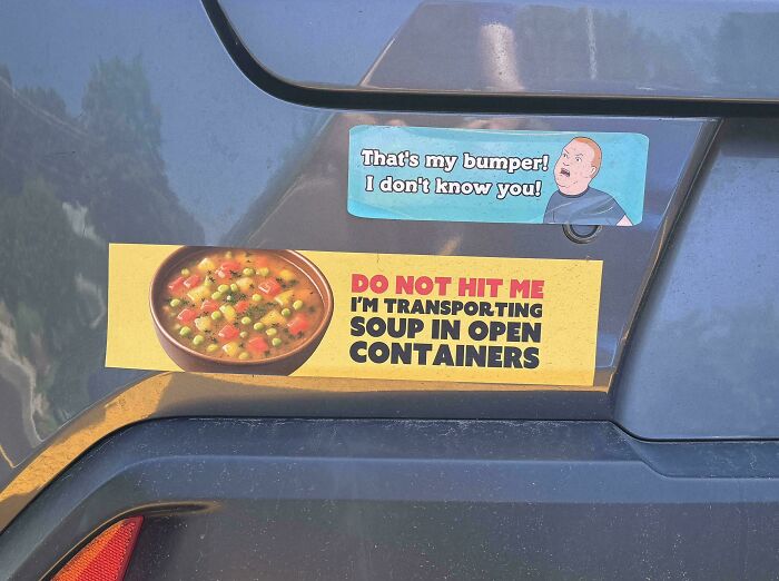 Funny bumper stickers on a car, one saying That's my bumper! I don't know you! and another DO NOT HIT ME I'M TRANSPORTING SOUP.
