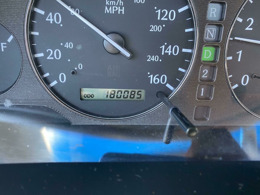 Close-up of a car odometer showing the mileage 180085, one of many amusing things to improve your day.