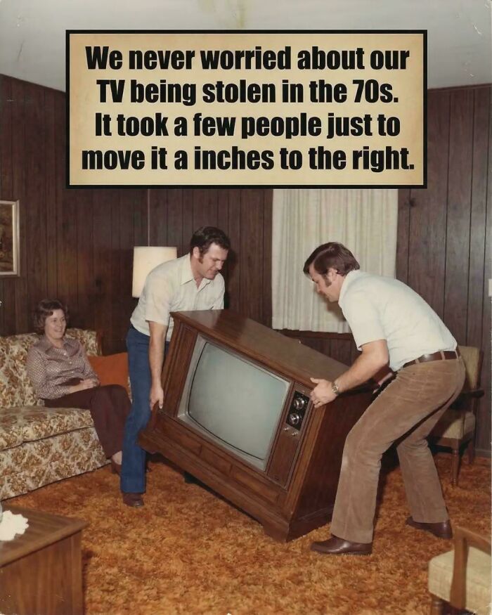 A retro meme showing two men moving a heavy TV in the 70s, highlighting the humor in ancient memes that still crack people up.