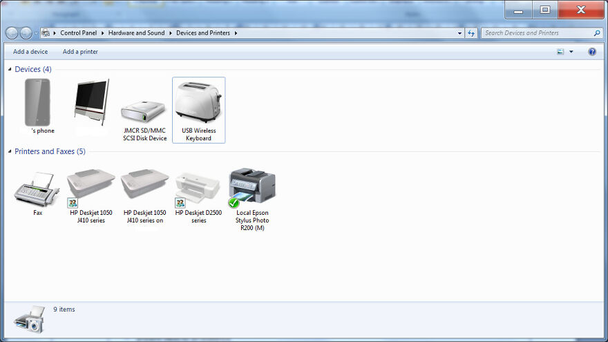 A computer screen showing devices and printers, including a toaster and various printers, among amusing things.