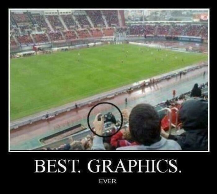 Humorous meme displaying a person at a real football match, holding a video game controller, captioned BEST. GRAPHICS. EVER.