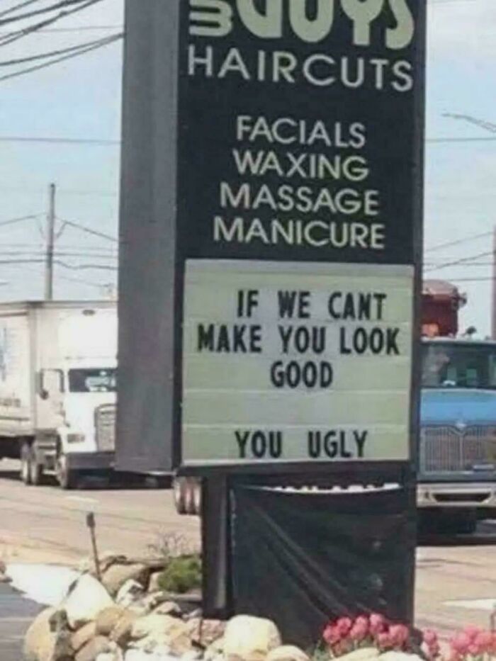 A funny salon sign with a humorous slogan that still cracks people up, an ancient meme.