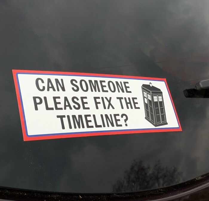 Wild bumper sticker on a car window with a drawing of the Tardis and the text Can someone please fix the timeline?