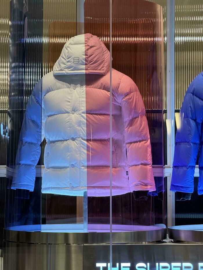 A surprisingly simple and genius idea of a split-color puffer jacket on display.