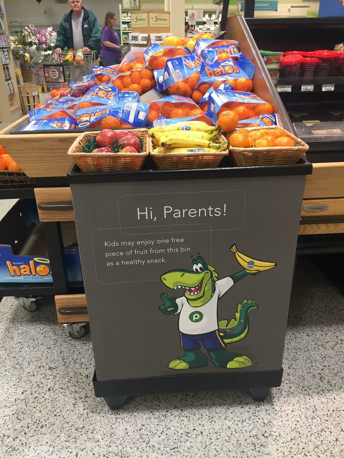 Grocery store display offering free fruit for kids, a simple and genius idea to solve everyday problems with healthy snacks.