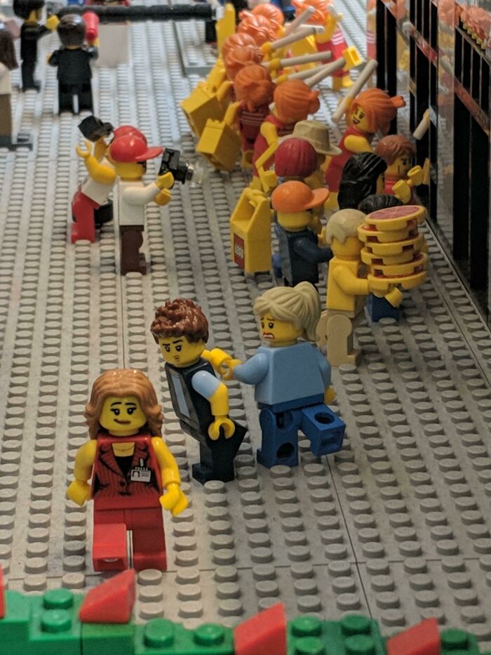 Lego minifigures in a detailed scene, illustrating simple and genius ideas within a miniature world.