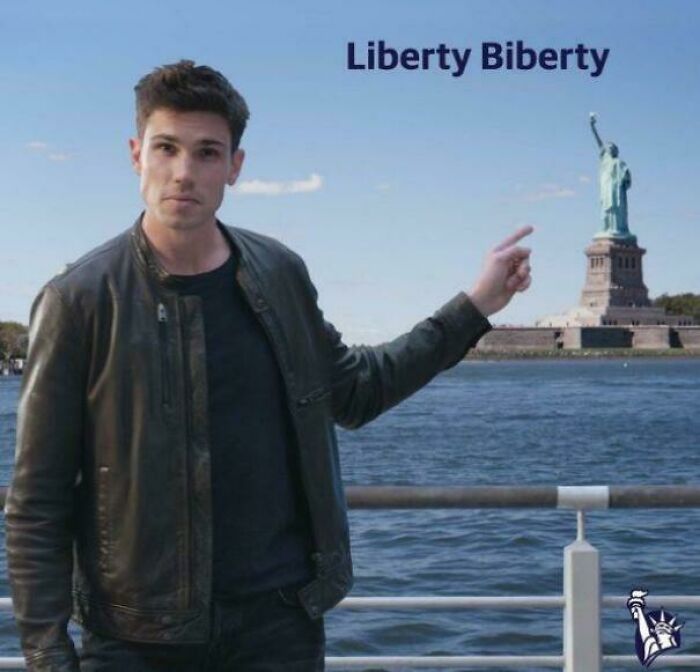 Man pointing at Statue of Liberty for a Liberty Mutual commercial.