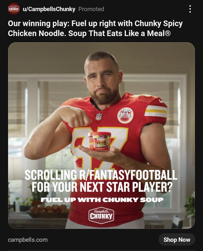 A football player holding a can of Chunky Spicy Chicken Noodle soup, featured in a commercial.