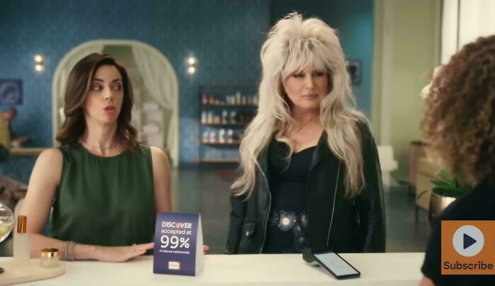 Two women in a salon, one with big hair, representing commercials people can't stand.