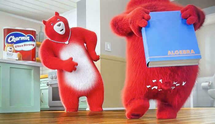 Two red cartoon bears from Charmin Ultra Strong commercials, one holding an Algebra book. These are commercials people can't stand.