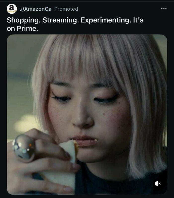 A woman with pink hair eating, an Amazon Prime commercial people can't stand.