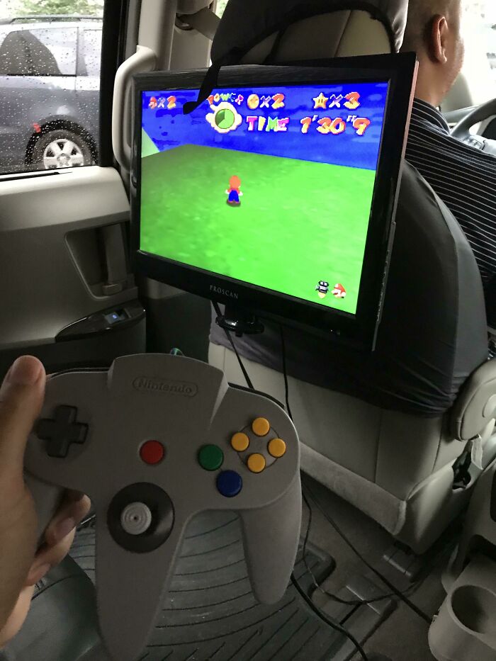 An in-car N64 setup for gaming on the go, a surprisingly simple and genius idea to solve boredom.