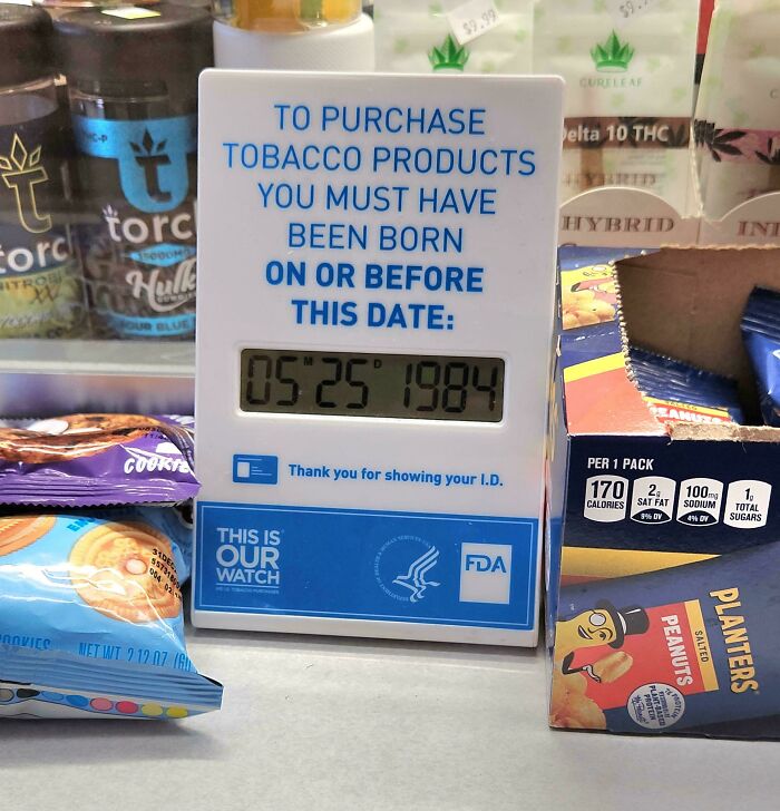 A sign indicating a birth date for tobacco purchase, an example of how businesses solve everyday problems with genius ideas.