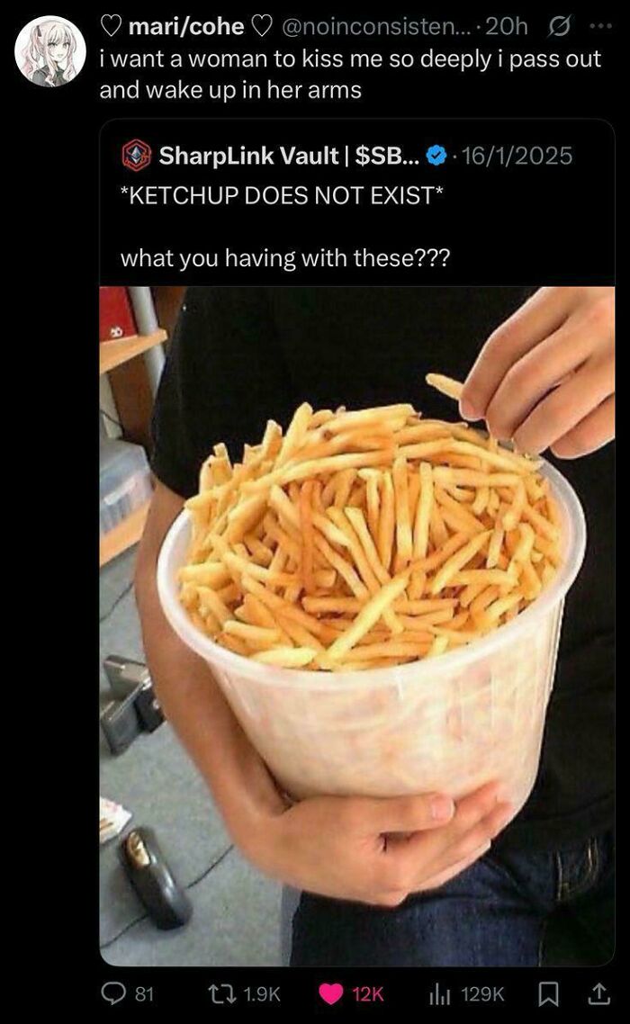 A person holds a giant bucket of french fries, responding to unhinged things people shared about ketchup not existing.