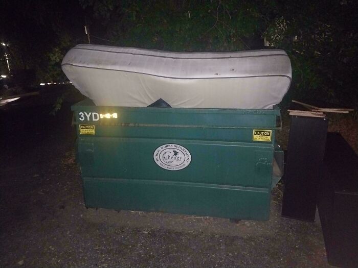 A mattress on top of a dumpster, showing people who think they are the main character.