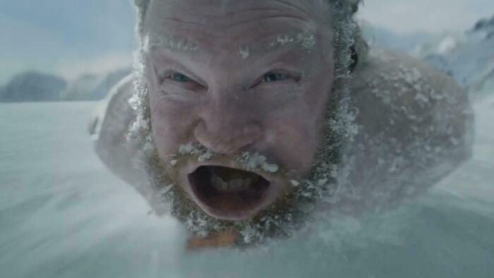 A man covered in ice and snow with an open mouth, part of a commercial people can't stand.