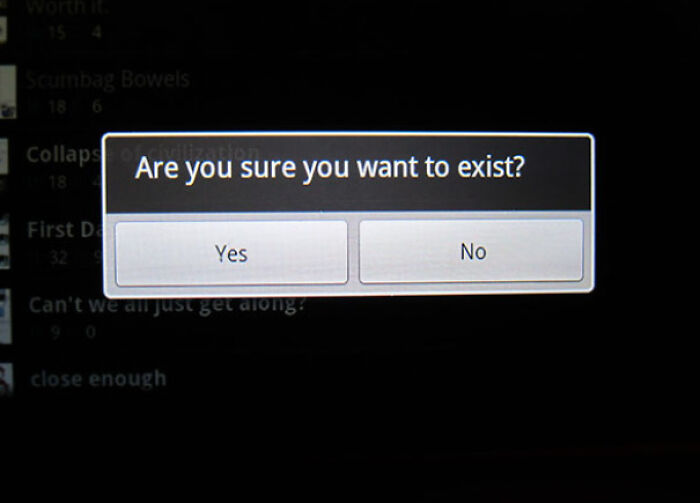 A computer screen showing a pop-up dialog box asking, Are you sure you want to exist? A blursed meme.