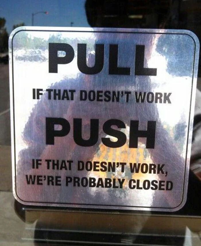 A funny sign on a door that says PULL, PUSH, or closed, creating a blursed meme.
