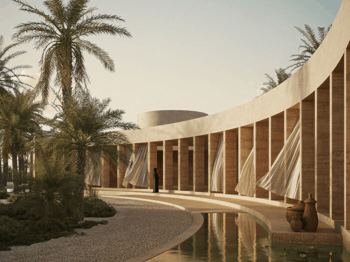 Beautiful modern architecture design with a curved, colonnaded structure among palm trees and a reflective water feature.