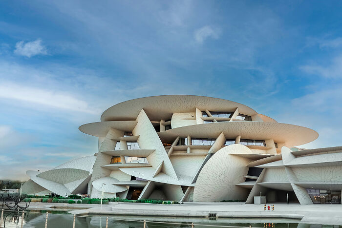 Amazing and beautiful modern architecture designs highlight a sprawling, white building with intricate, disc-like structures and fluid shapes.