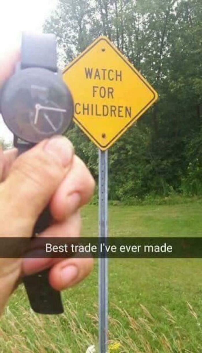 A hand holding a watch with a broken face next to a yellow 'Watch for Children' sign, a funny ancient meme.