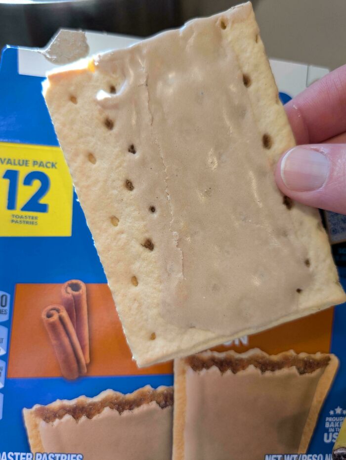 A hand holds a sad-looking toaster pastry, illustrating poor marketing practices.