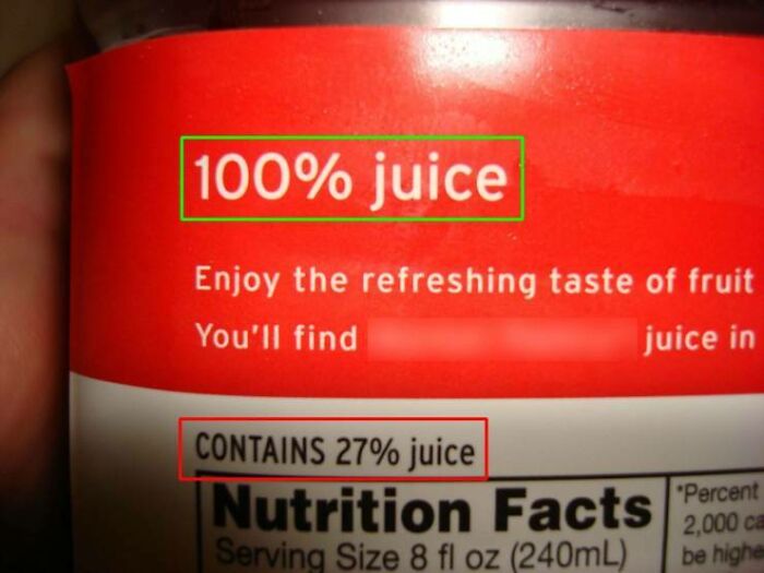 A close-up of a beverage label with text highlighted in green and red boxes. The green box states '100% juice' while the red box below states 'CONTAINS 27% juice,' an infuriating marketing practice.