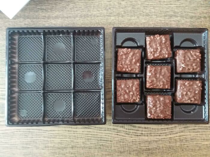 Two chocolate boxes side-by-side. One is full of chocolates in a nine-square grid, the other empty, showing infuriating marketing practices due to excess packaging.