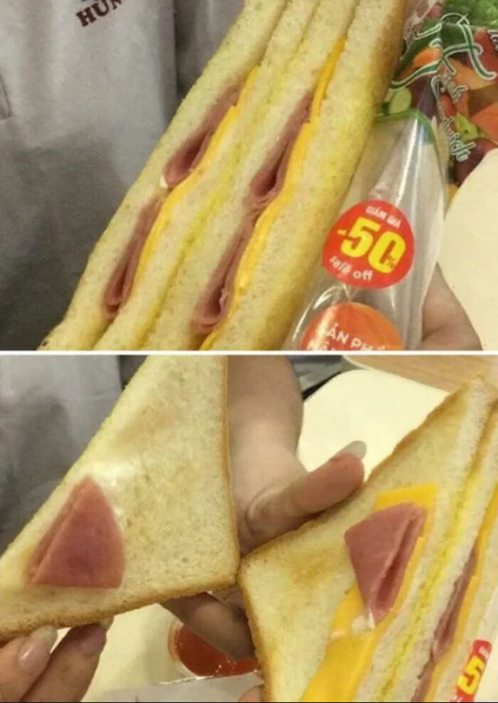 Sandwich with minimal ham and cheese filling compared to its packaging, highlighting infuriating marketing practices.