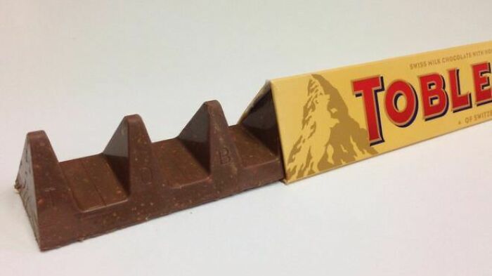 Toblerone chocolate bar with large gaps between triangles, a result of infuriating marketing practices.