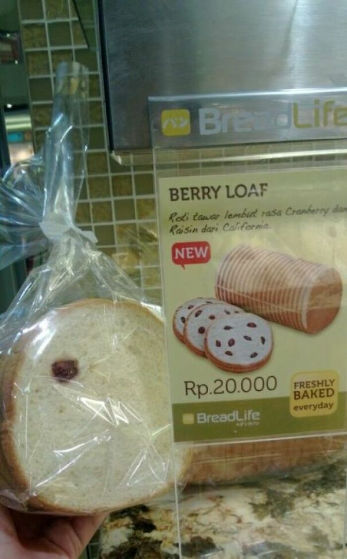 Bread package showing a single piece of fruit, while the ad shows many more, infuriating marketing practices.