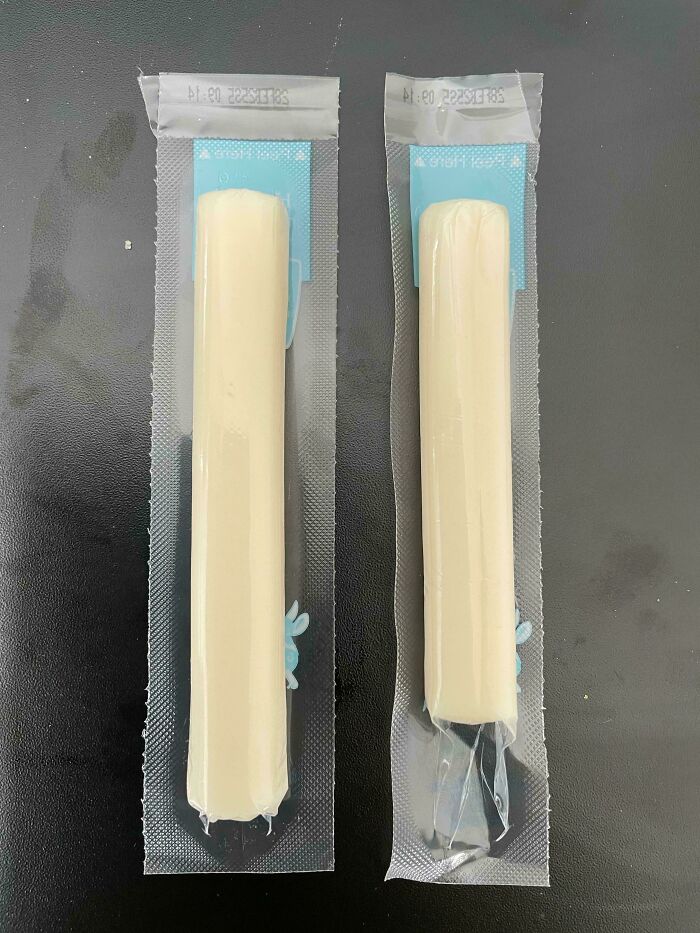 Two individually wrapped string cheese snacks, revealing infatuating marketing practices with differing sizes.