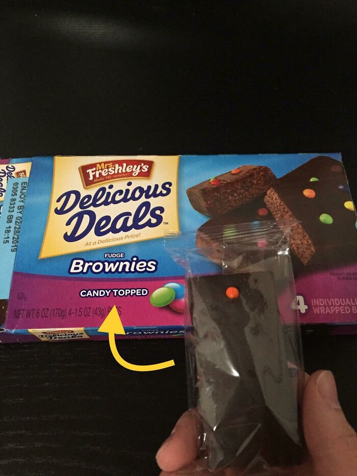 Mrs. Freshleys Delicious Deals Fudge Brownies box next to a single brownie, highlighting infuriating marketing practices.