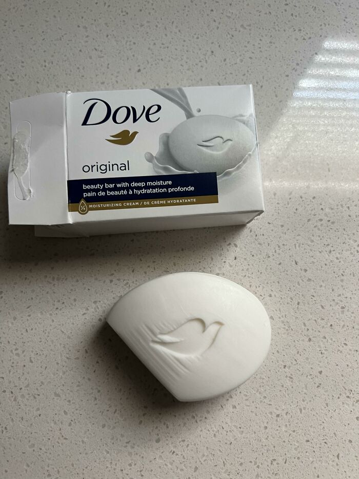 A Dove beauty bar and its box, showing the small soap size compared to the packaging, an infuriating marketing practice.