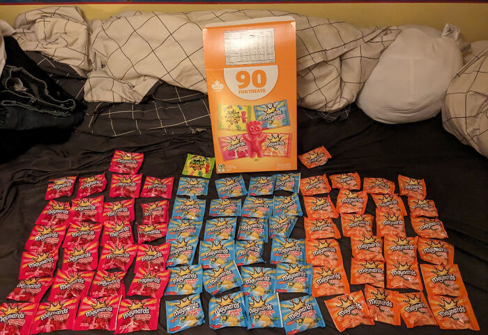 A large box of Maynard's 90 Fun Treats next to many small individual bags, demonstrating infuriating marketing practices.
