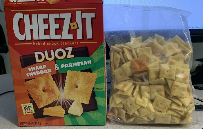 A Cheez-It Duoz box next to a clear bag containing a small amount of crackers, highlighting infuriating marketing practices.