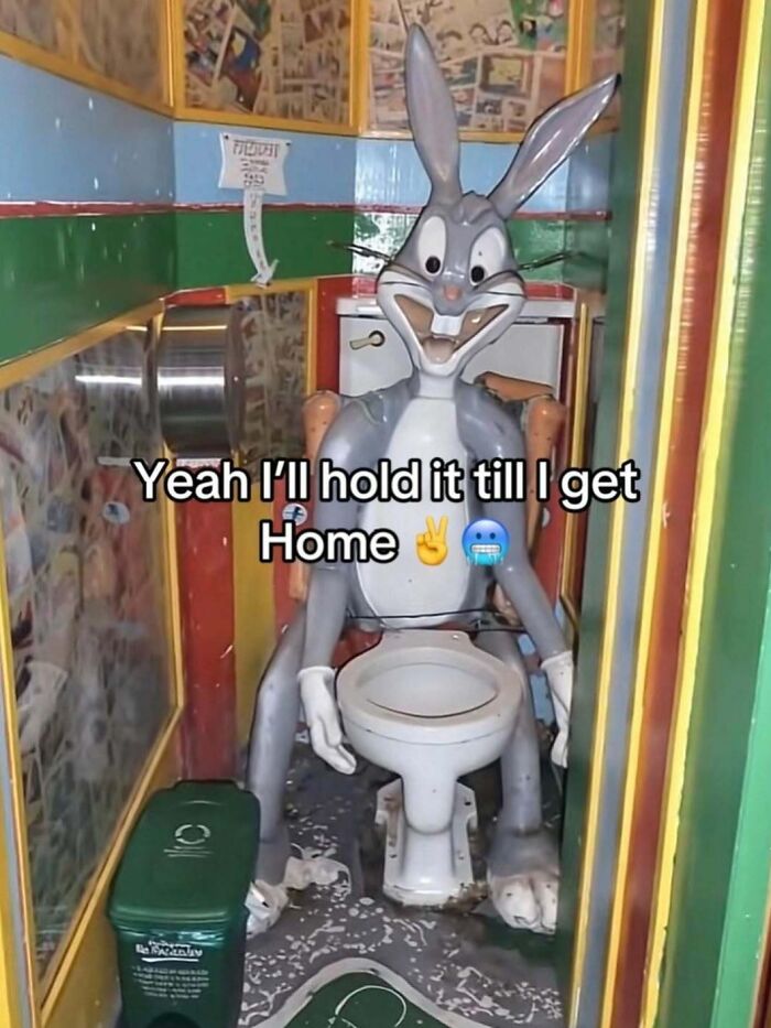 A Bugs Bunny statue sitting on a toilet with the text Yeah I'll hold it till I get Home, a completely unhinged meme.