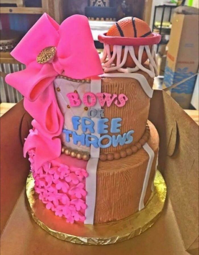 A dual-themed gender reveal cake: one side with a pink bow for 'Bows', the other with a basketball hoop for 'Free Throws' in a gender reveal.