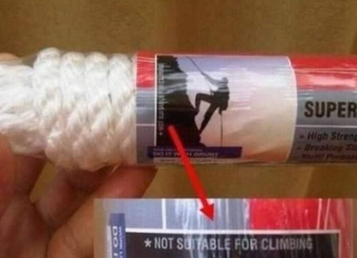 A white rope with packaging that shows a rock climber, but a warning label states Not Suitable for Climbing, an example of infuriating marketing practices.