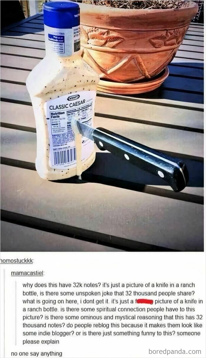 A bottle of Classic Caesar dressing with a knife stuck into it, prompting comments correcting someone online about the image's meaning.