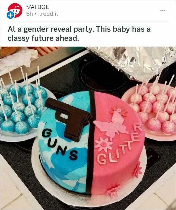A gender reveal cake split pink and blue, with Guns on blue and Glitter on pink, surrounded by cake pops.