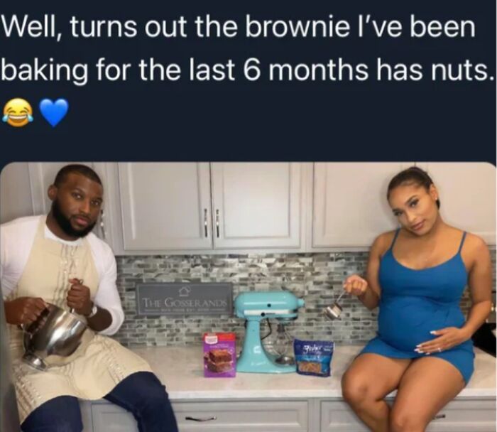 A pregnant woman and a man in a kitchen with brownie mix, part of a gender reveal moment.