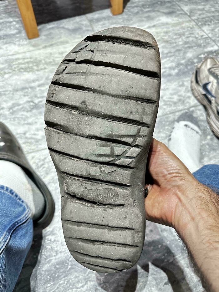 Clever solution: a worn shoe sole patched with a new piece, demonstrating a clever fix for random junk.