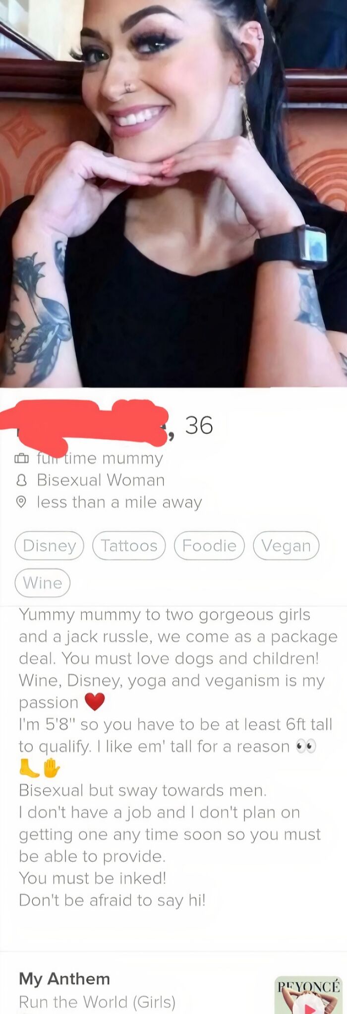 A smiling woman with tattoos and a dating app profile listing high dating standards, including height and providing for her.